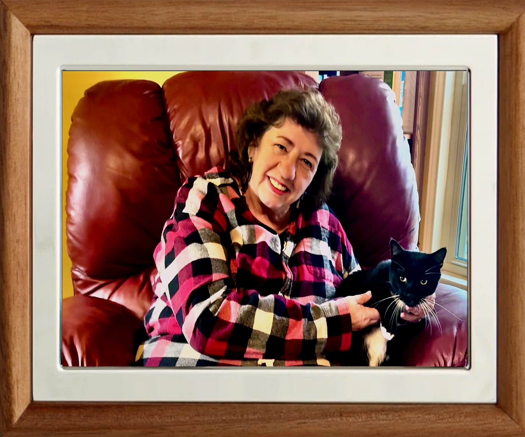 Anne Bressert holding her black cat